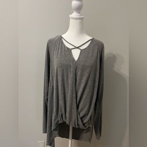 𝅺WHBM Gray shirt, cutouts in front and longer in back. Knit.